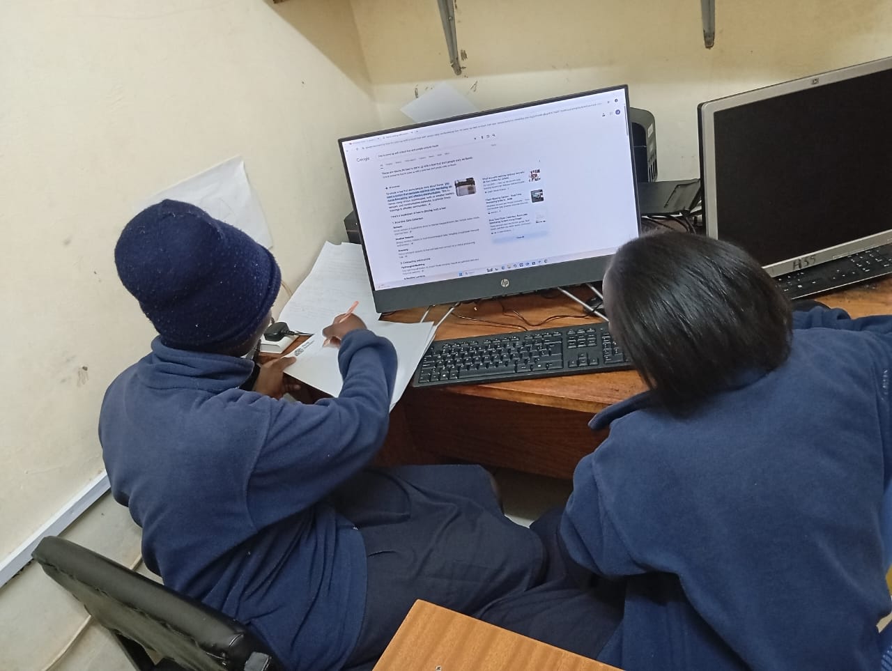 Students being guided in computer laboratory